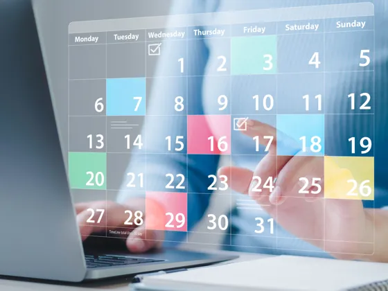 A person view an online calendar on a laptop PC.