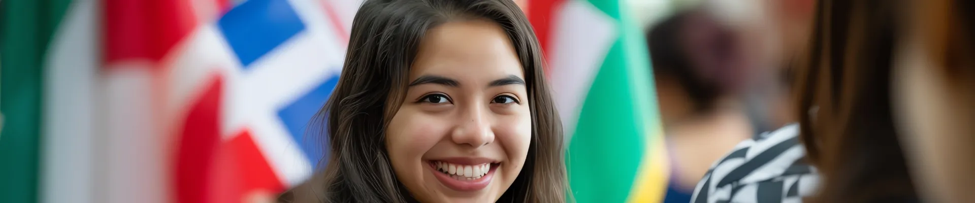 Female international student framed with world flags.