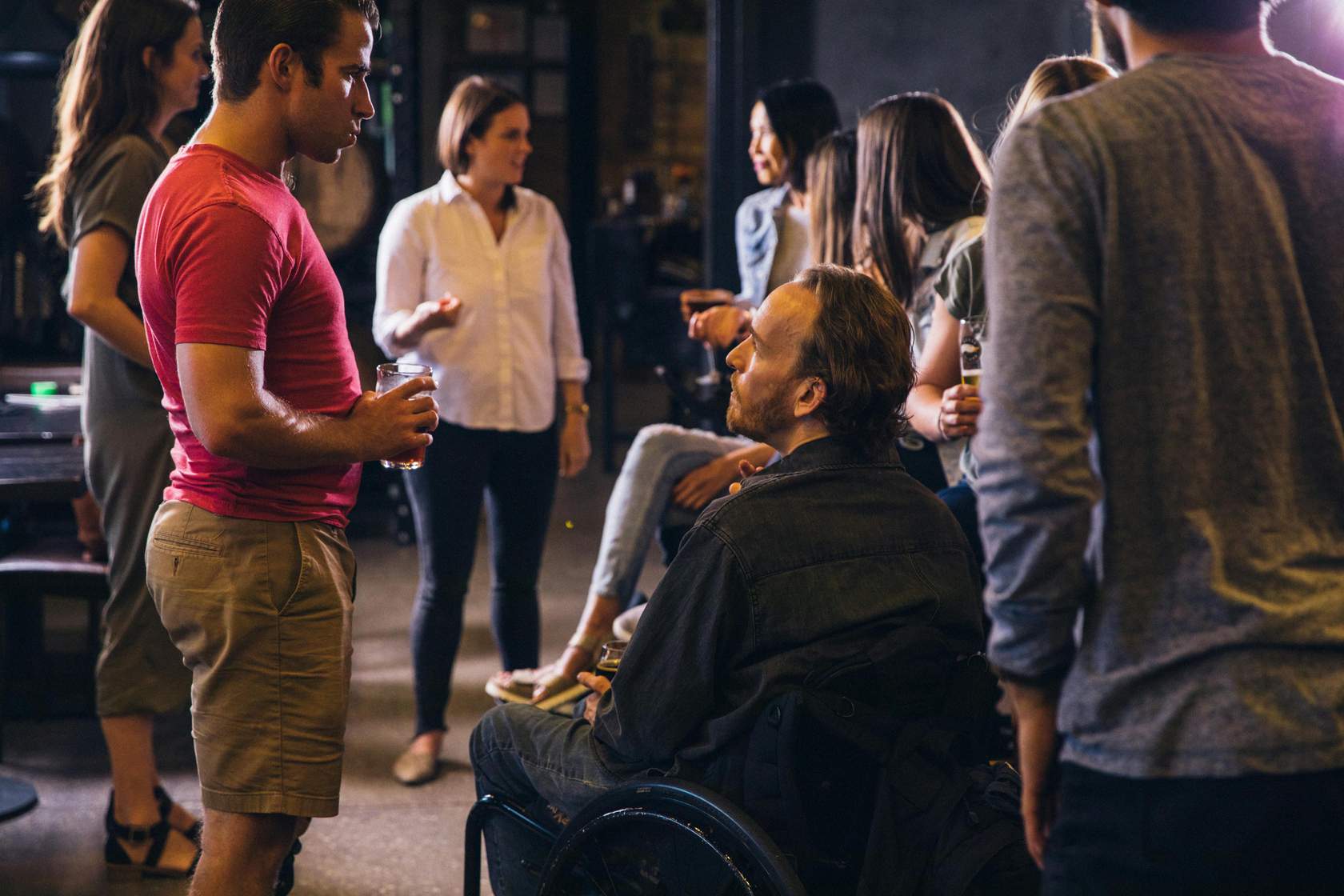 Group of diverse individuals engaged in conversation
