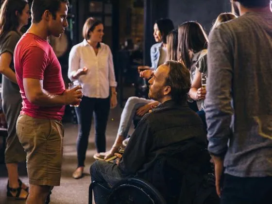 Group of diverse individuals engaged in conversation
